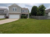 Charming two-story home featuring a two-car garage, brick accents, and a well-maintained lawn at 8415 Fieldfare Way, Indianapolis, IN 46237