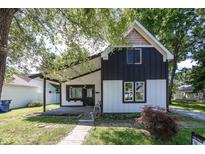 Charming two-story home with a modern black and white exterior at 12003 Broadway St, Indianapolis, IN 46236