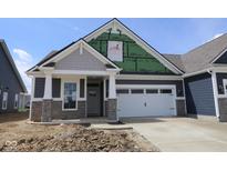 Charming new home featuring stone accents, gray siding, and a two-car garage with modern architectural details at 12524 Morning Ridge Way, Noblesville, IN 46060