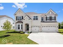 Beautiful two-story home with brick exterior, three-car garage, and well-manicured lawn at 4253 Ironclad Dr, Bargersville, IN 46106