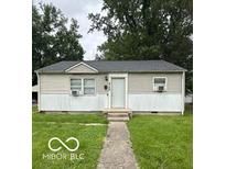 Charming single-story home with neutral siding, manicured lawn, and inviting front entrance at 4744 E 33Rd St, Indianapolis, IN 46218
