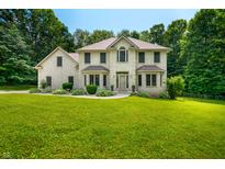 Stunning two-story home with a well-manicured lawn and professional landscaping at 5055 Turkey Track Rd, Martinsville, IN 46151