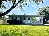 Charming single-story home featuring a well-maintained lawn, cozy entrance, and ample natural light at 737 Howard St, Shelbyville, IN 46176