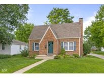Charming brick home with a well-maintained lawn and inviting front entrance at 1944 Union St, Columbus, IN 47201