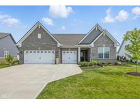 Beautiful single Gathering home featuring an attached three car garage and manicured lawn at 3839 Albert Ln, Bargersville, IN 46106