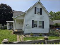 Charming two-story home featuring a cozy porch and classic shutters at 627 Plum St, Noblesville, IN 46060
