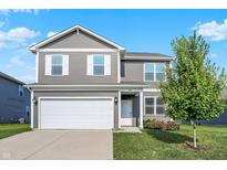 Charming two-story home with gray siding, white trim, attached two car garage, and well-maintained landscaping at 851 Sonoma Ln, Greenfield, IN 46140