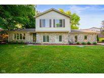 Charming stone-faced two-story home with a well-maintained lawn and lovely curb appeal at 1031 Lancashire Ln, Pendleton, IN 46064