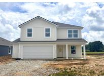 Charming two-story home with a two car garage and inviting front porch at 1207 Mcbride St, Greenfield, IN 46140