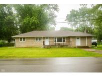 Charming single-story home featuring a stone facade and a well-manicured front lawn at 196 Park Ave, Bargersville, IN 46106