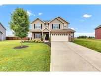 Two-story home with a brick and siding facade, complemented by a well-manicured lawn and a two-car garage at 937 Maple Stone Dr, Greenwood, IN 46143