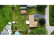 Aerial view of the property featuring a well-maintained lawn, outbuilding, and a convenient driveway at 2914 E Blue Ridge Orch, Shelbyville, IN 46176