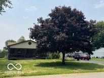 Charming home with a covered front porch and well-established landscaping at 2914 E Blue Ridge Orch, Shelbyville, IN 46176