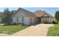 Charming single-Gathering home with a two-car garage, well-maintained lawn and mature trees at 4230 Raintree Blvd, Greenwood, IN 46143