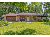 Charming single-story brick home with a well-manicured lawn and an attached garage at 436 N 500 W, Anderson, IN 46011