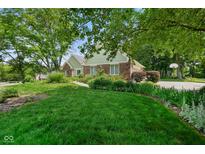 Charming home with a well-maintained lawn and lush landscaping at 6118 Deerwood Dr, Greenwood, IN 46143