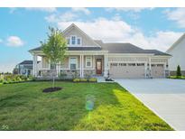 Charming single-Gathering home with a manicured lawn and a three-car garage at 7284 Bayview Run, McCordsville, IN 46055