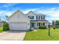 Charming two-story home with attached two-car garage, well-maintained lawn, and inviting curb appeal at 7337 Wythe Dr, Noblesville, IN 46062