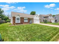 Charming single-story brick home with a well-maintained lawn and attached garage at 8038 Sydney Ln, Avon, IN 46123