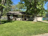 Charming home with a well-manicured front lawn and lovely curb appeal at 1108 Pierce Dr, Plainfield, IN 46168