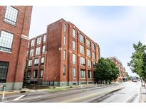 Brick apartment building with large windows offering abundant natural light and street view at 624 E Walnut St # 48, Indianapolis, IN 46204