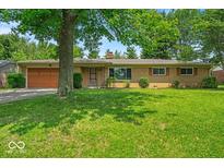 Charming single-story home with well-maintained front yard and attached garage at 108 Bennett Rd, Carmel, IN 46032