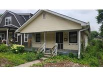 Charming single-Gathering home featuring a cozy front porch and small yard at 2157 Sugar Grove Ave, Indianapolis, IN 46202