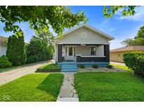 Charming single-story home with a well-manicured lawn and inviting curb appeal at 3329 Main St, Anderson, IN 46013