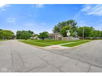 Charming single-story home with a well-maintained lawn and mature trees in a quiet neighborhood at 50 Crestview Dr, Greenwood, IN 46143