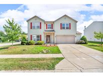 Charming two-story home featuring red shutters, a well-maintained lawn, and a classic suburban appeal at 10187 Yosemite Ln, Indianapolis, IN 46234
