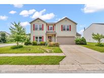 Charming two-story home with a well-maintained lawn and beautiful curb appeal at 10187 Yosemite Ln, Indianapolis, IN 46234