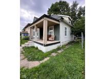 Charming single-Gathering home features a cozy front porch and inviting curb appeal at 1354 Edgemont Ave, Indianapolis, IN 46208