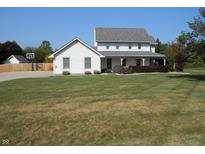 Charming two-story home with a well-manicured front yard and inviting covered porch at 2020 N Hickory Blvd, Greenfield, IN 46140