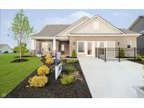 Charming brick home featuring manicured lawn and landscaping, complemented by a cozy front porch at 278 Evening Bay Ct, Pendleton, IN 46064