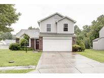 Charming two-story home with a brick and vinyl facade, a two-car garage, and a well-maintained front yard at 5234 Melbourne Rd, Indianapolis, IN 46228