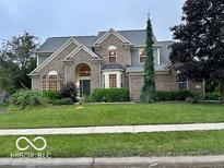 Charming two-story home with a well-maintained lawn and detailed brickwork at 13262 Landwood Dr, Fishers, IN 46037
