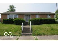 Charming single-story brick home with well-maintained landscaping and inviting front entrance at 1333 S B St, Elwood, IN 46036