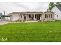Charming single-story home with a covered front porch and well-maintained lawn at 524 W Campbell St, Edinburgh, IN 46124