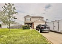 Charming two-story home features a well-manicured front yard, inviting entrance, and convenient driveway access at 5924 Sable Dr, Indianapolis, IN 46221