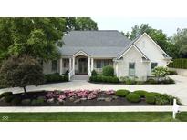 Charming home with stone accents, a well-manicured lawn, and inviting curb appeal at 7106 Royal Oakland Dr, Indianapolis, IN 46236