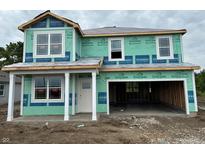 New construction home showcasing the early phase with siding, windows, and an attached two-car garage at 9334 Hemingway Dr, Indianapolis, IN 46239