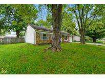 Charming single-story brick home with a well-manicured lawn and mature shade trees at 99 Old Trail Dr, Bargersville, IN 46106