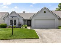 Charming single-Gathering home with a well-manicured lawn and attached two-car garage at 10753 Seaview Ln, Indianapolis, IN 46236