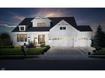 Stunning two-story home featuring a three-car garage and welcoming front porch with beautiful architectural details at 14682 Braemar E Ave, Noblesville, IN 46062