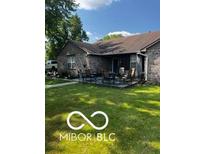 Charming brick home featuring an inviting outdoor patio, perfect for relaxing and entertaining at 241 Deborah Ln, Whiteland, IN 46184