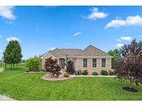 Charming single-story brick home with a well-manicured lawn and mature landscaping at 4434 Hickory Ridge Blvd, Greenwood, IN 46143