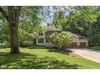 Beautiful two story home with stone and brickwork, professional landscaping and a three car garage at 4446 Lakeridge Dr, Indianapolis, IN 46234