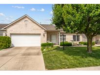Charming single-story brick home with a well-manicured lawn and attached two-car garage at 564 Parkhurst Ct, Greenwood, IN 46142