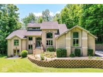 Stunning two-story brick home with manicured landscaping and a welcoming front entrance at 8004 Lafayette Rd, Indianapolis, IN 46278