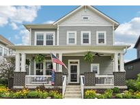 Charming two-story home featuring a welcoming front porch with beautiful landscaping at 2105 Granville Dr, Westfield, IN 46074
